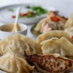 Plate of crispy bottomed gyoza dumplings