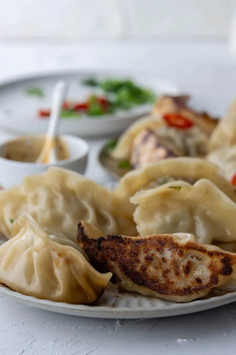 Plate of crispy bottomed gyoza dumplings