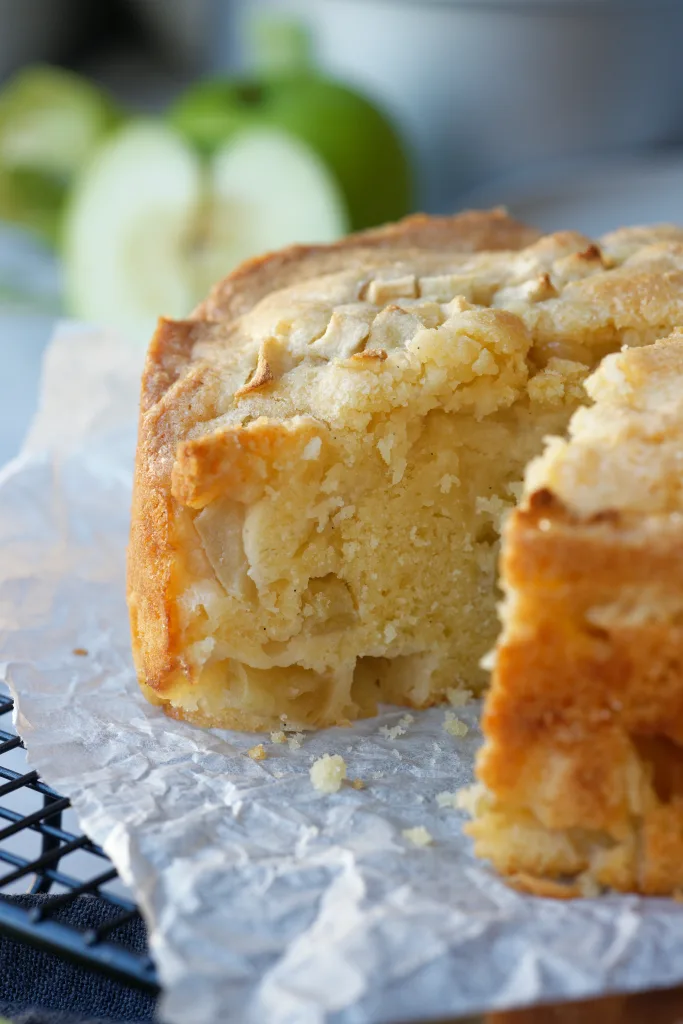 Close up view of apple cake to show fluffy texture