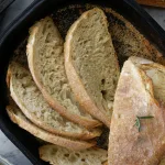 Sliced bread in cast iron pan