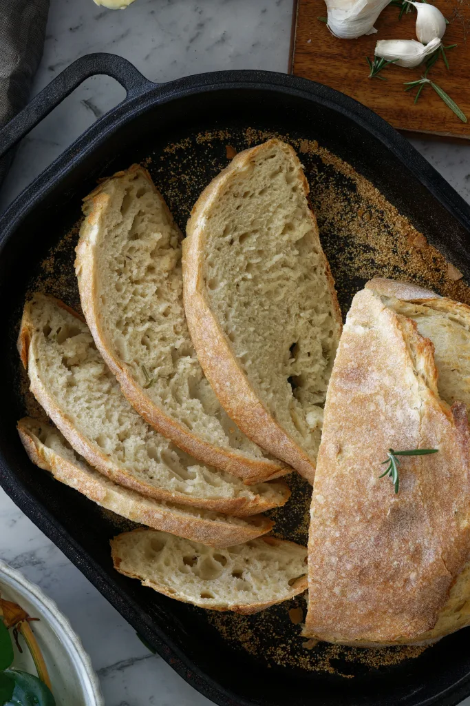 Sliced bread in cast iron pan