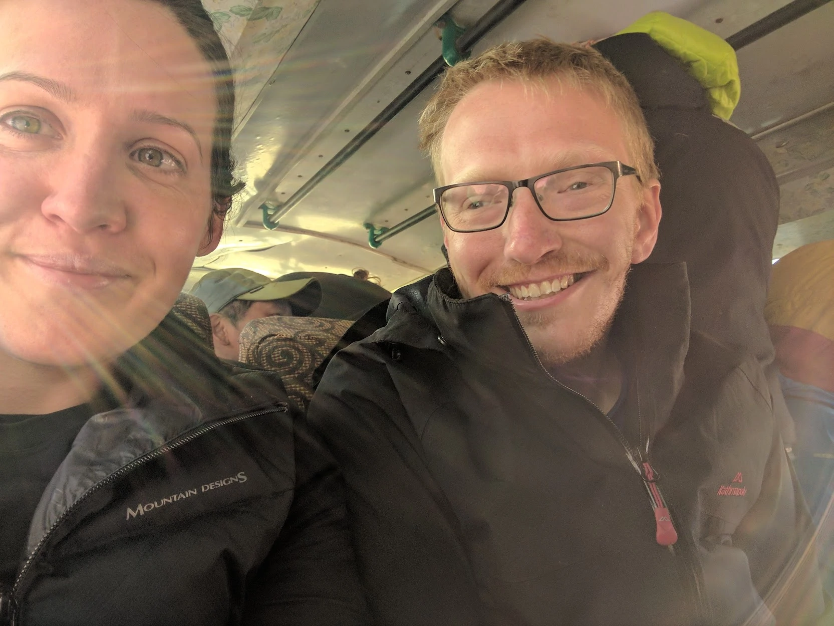 Image of Molly and Exceede smiling in a Nepal bus
