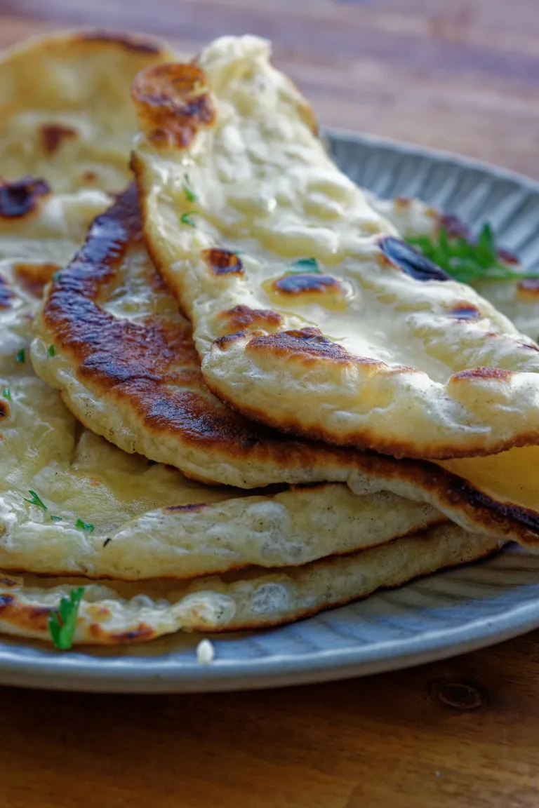 Stack of naan bread on plate