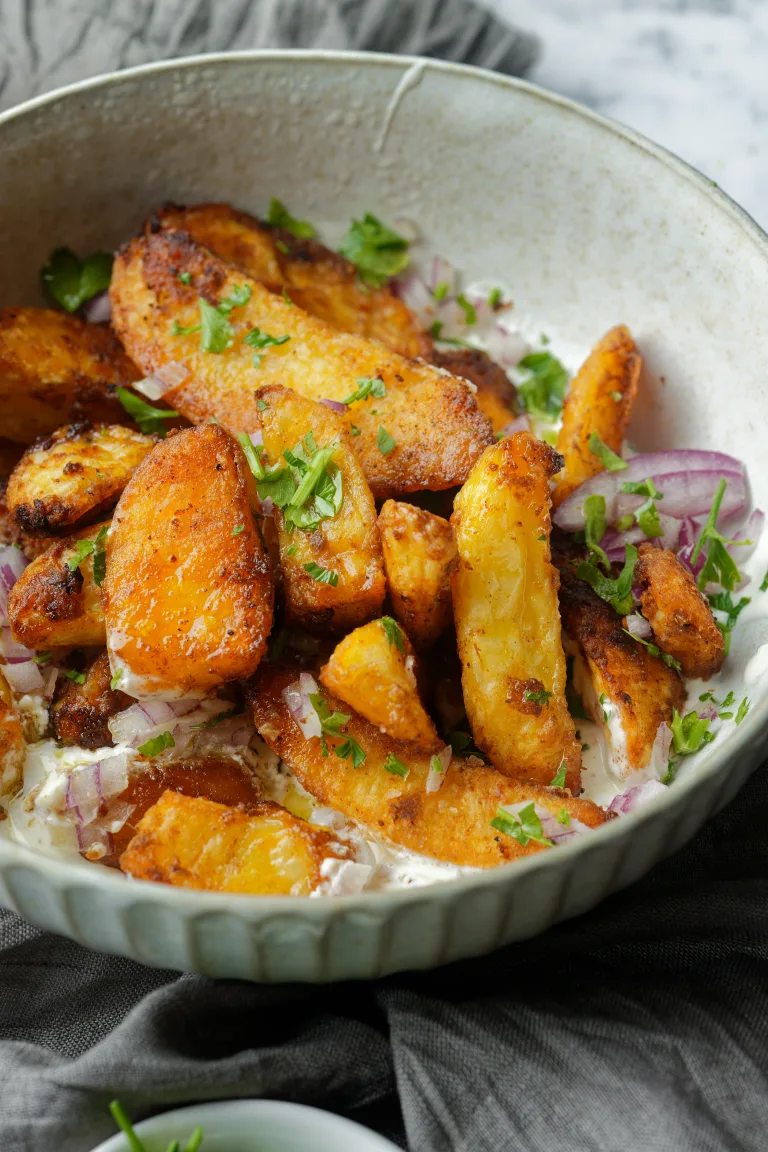 Roasted Potatoes and herb in grey bowl