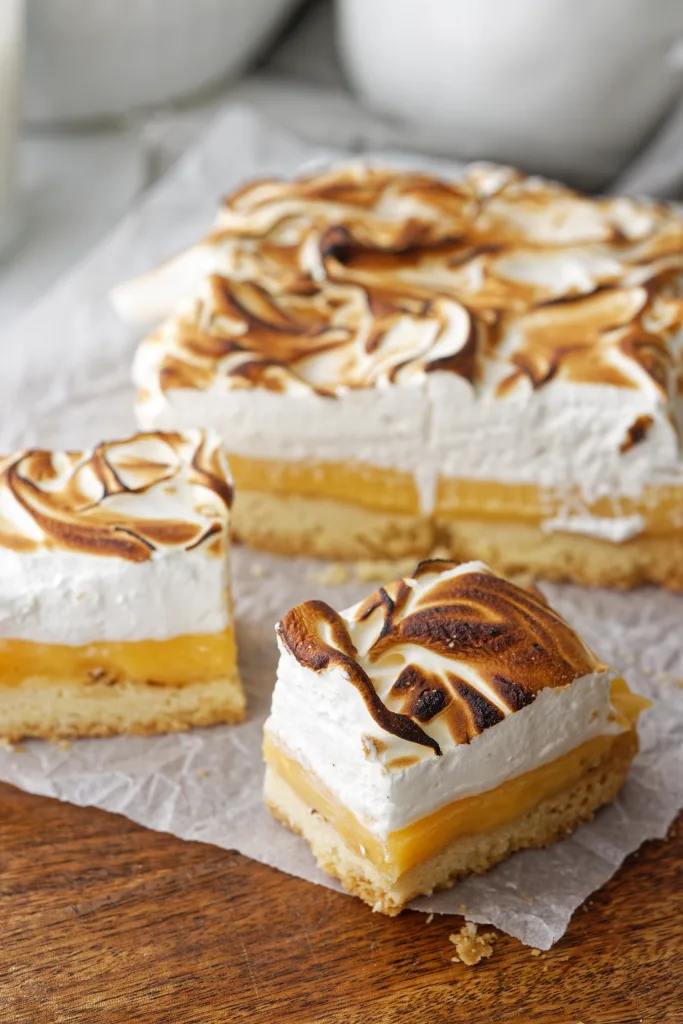 squares of Lemon Meringue slice on baking paper