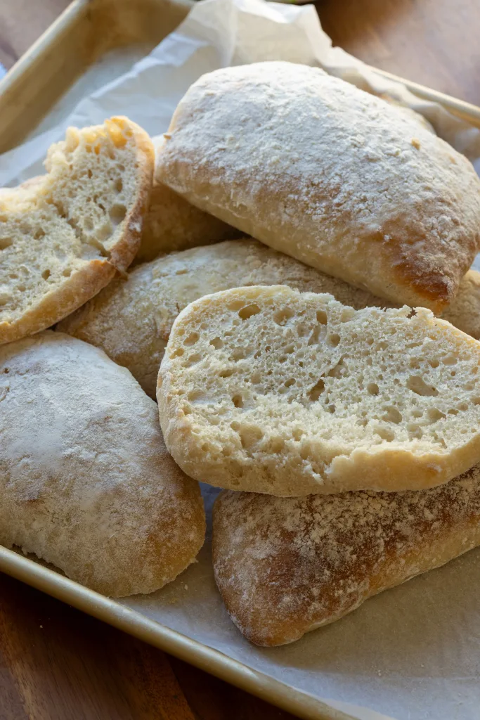Bread loaves stacked on baking tray