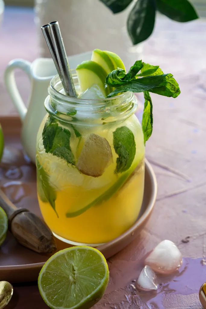 Bright fruity and iced drink in mason jar