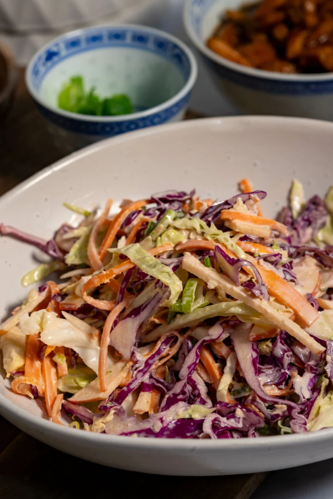 Rainbow slaw with ginger dressing and apple slices.