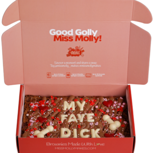 Naughty brownie slab with 'MY FACE DICK' in white chocolate letters and sprinkles