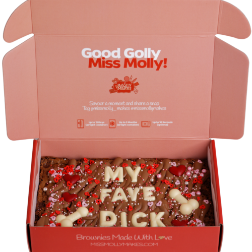 Naughty brownie slab with 'MY FACE DICK' in white chocolate letters and sprinkles