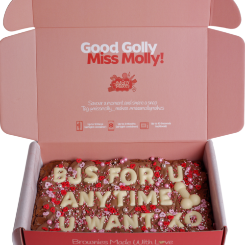 Naughty brownie slab with 'BJS FOR U ANYTIME U WANT' in white chocolate letters penis icon and sprinkles