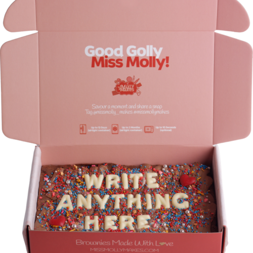 Slab of brownie with 'Write Anything Here' in white chocolate letters and sprinkles